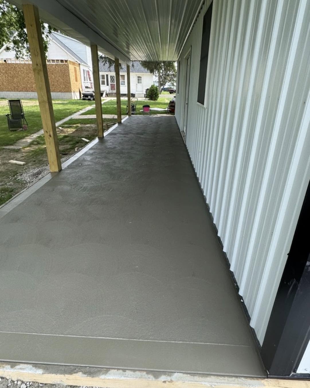 Finished concrete patio under a covered porch